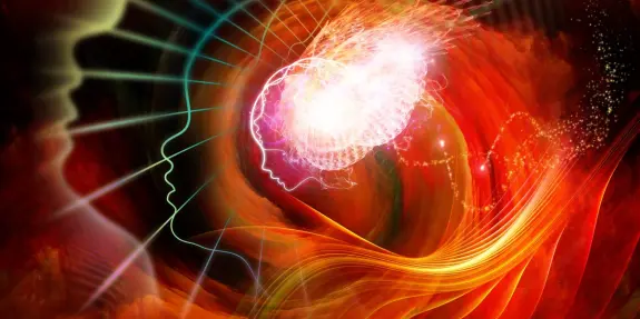 Abstract illustration of two human profiles with vibrant colors, swirling patterns, and a glowing brain at the center.