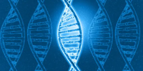 Blue, glowing double helix DNA strands with a bright central focus, set against a dark background.