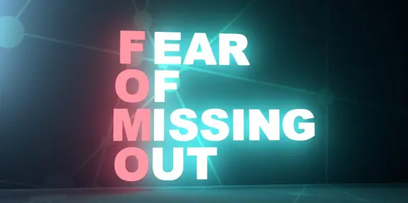 Bold text reading "FOMO" in pink and blue, with "FEAR OF MISSING OUT" below, set against a dark, abstract background.