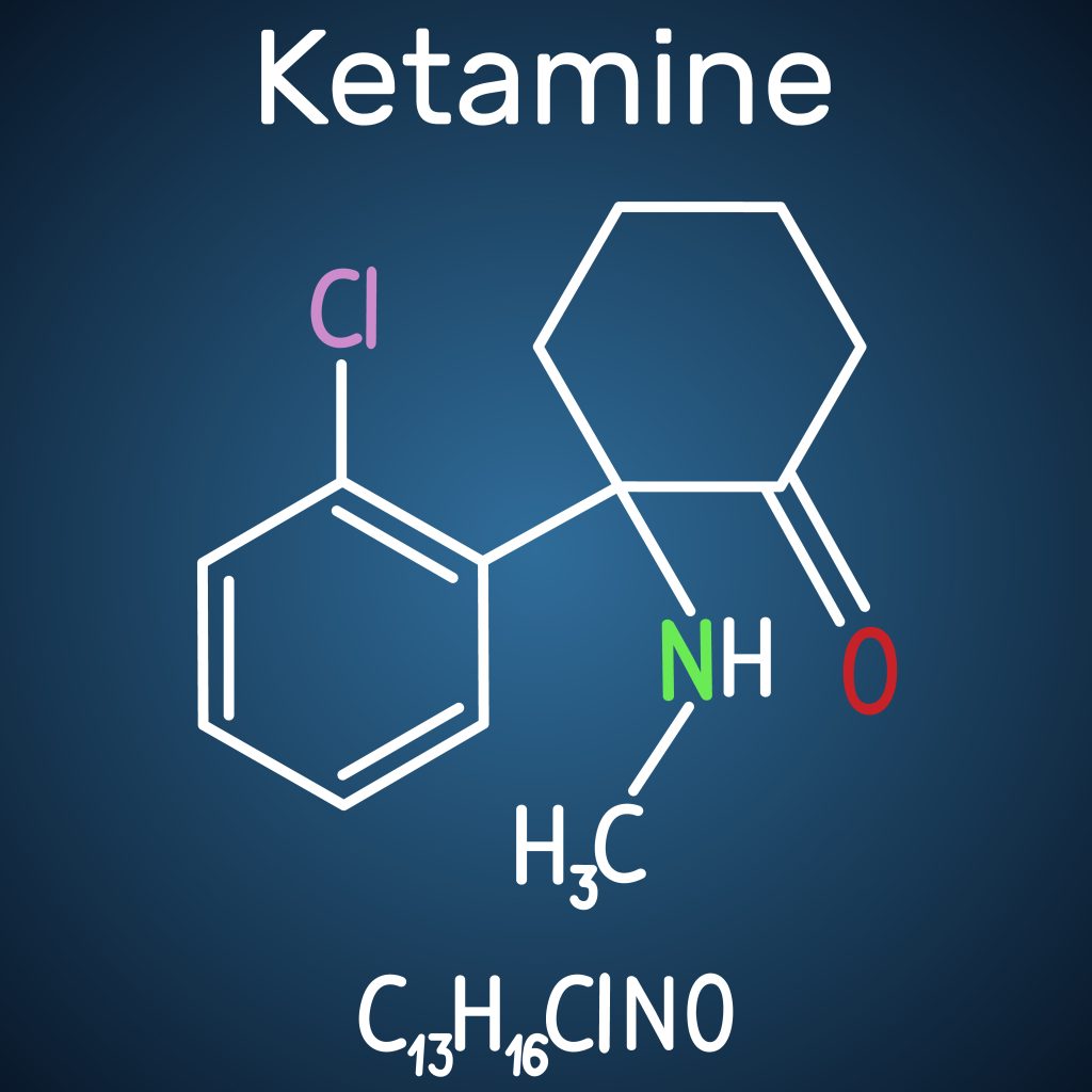 Chemical structure of ketamine, featuring a molecular formula and labeled elements on a dark blue background.