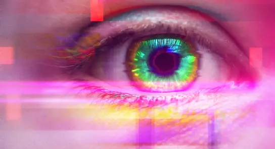 Close-up of a vibrant green eye with digital glitch effects in pink and purple hues surrounding it.