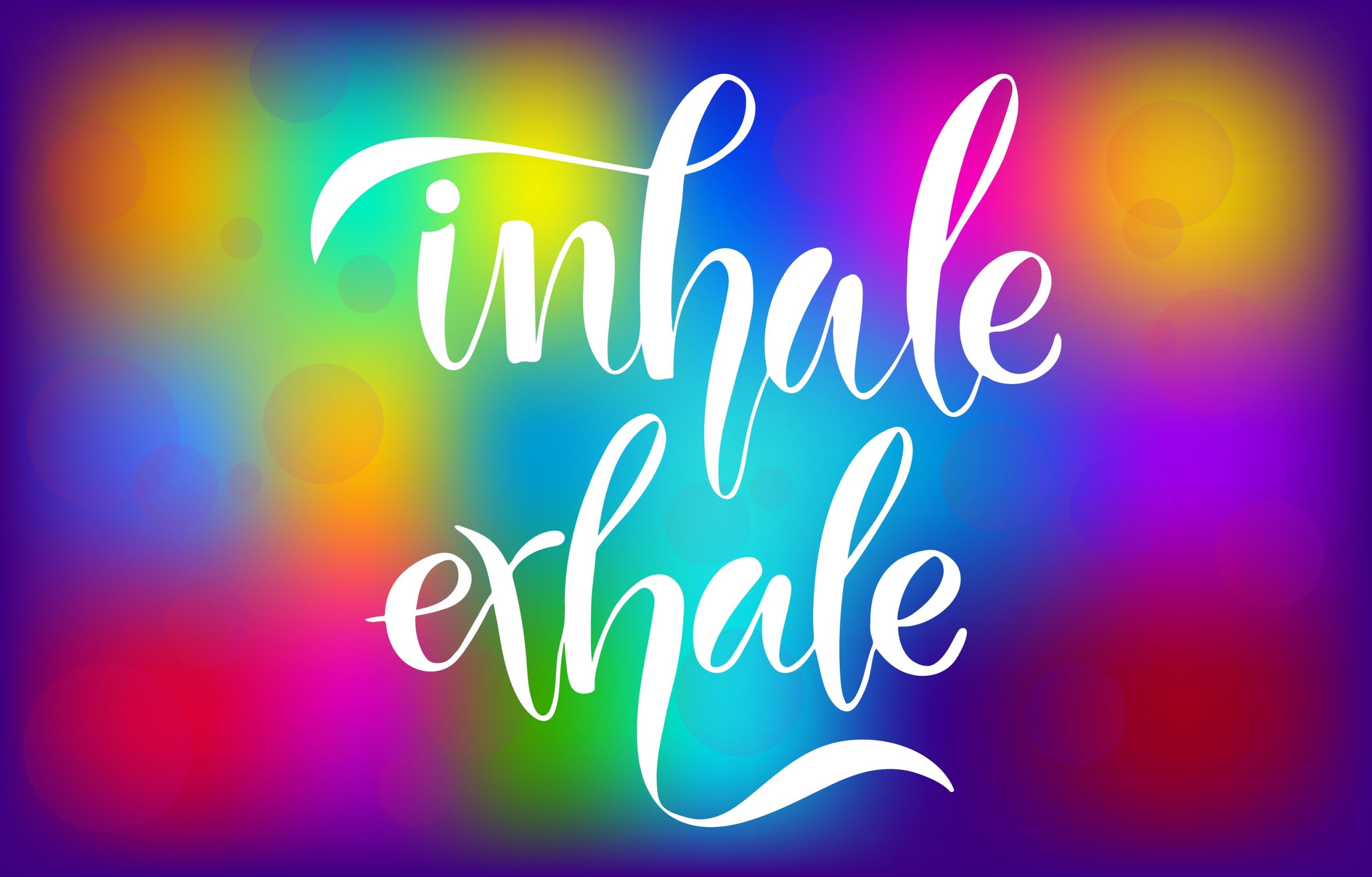 Colorful abstract background with the words "inhale" and "exhale" in elegant white script.
