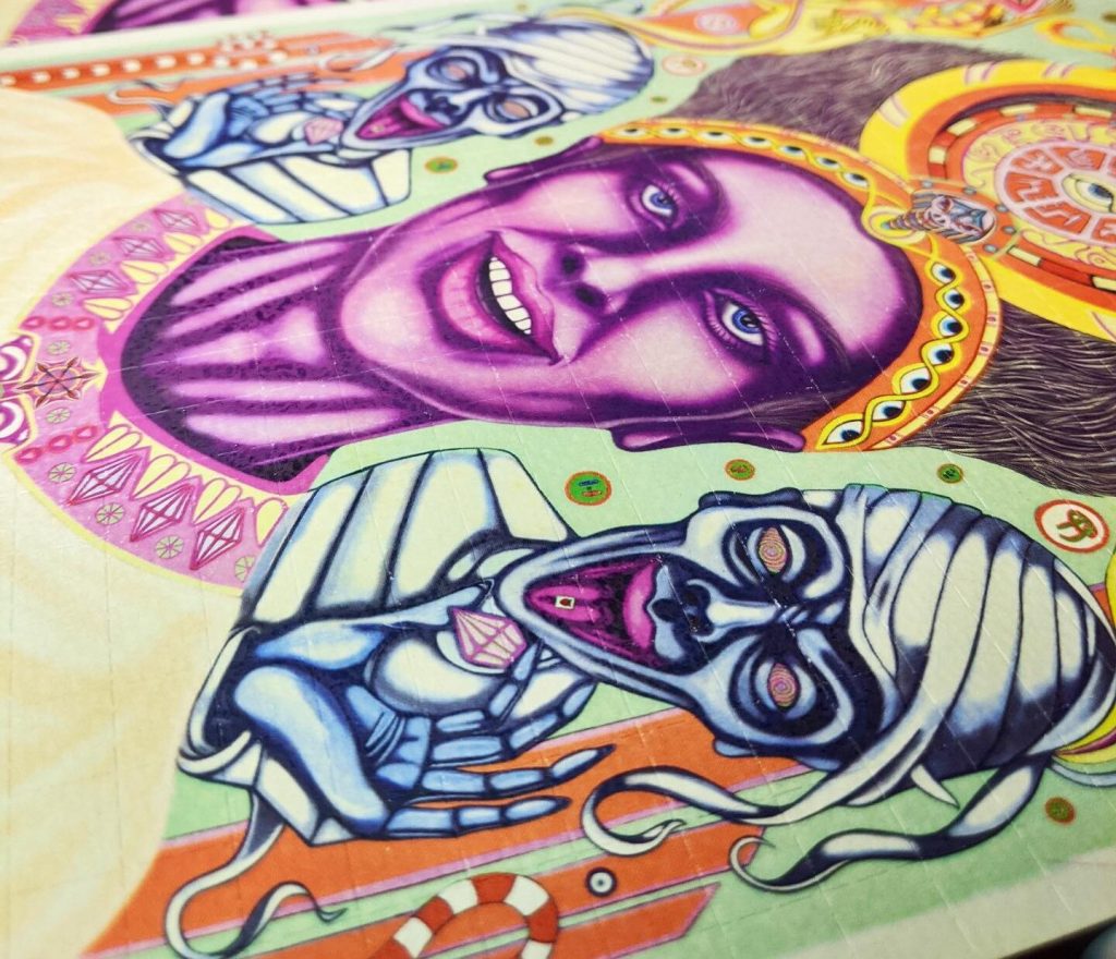 Colorful artwork featuring stylized faces with exaggerated expressions, intricate patterns, and vibrant hues.