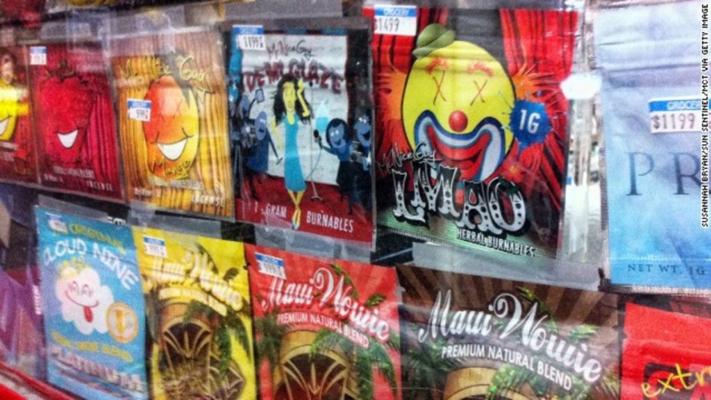 Colorful packaging of various herbal products displayed in a vending machine, featuring playful designs and bold text.