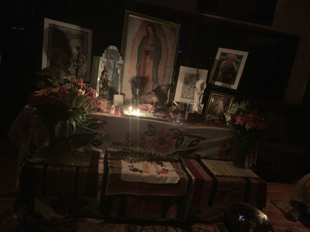 dimly-lit-altar-adorned-flowers.jpg