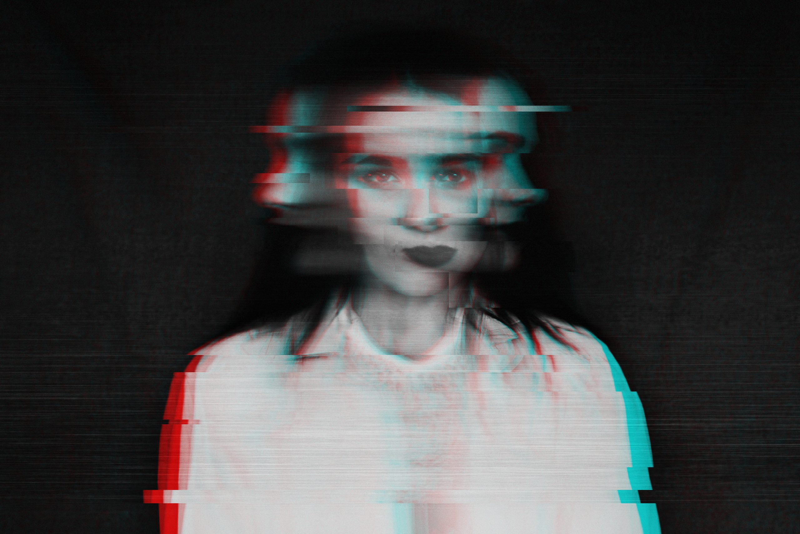 A distorted portrait of a woman with blurred features, creating a glitchy, surreal effect against a dark background.
