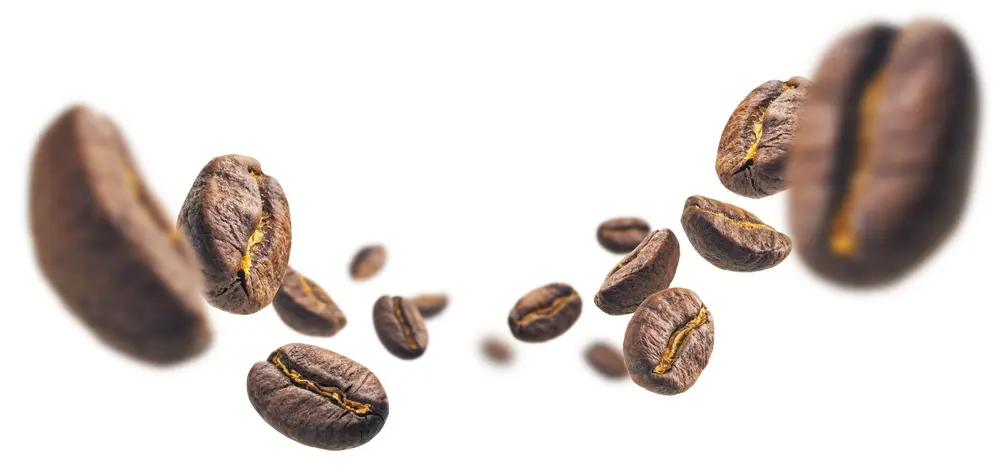 Floating coffee beans with a rich, dark texture and golden cracks, creating a dynamic sense of movement.