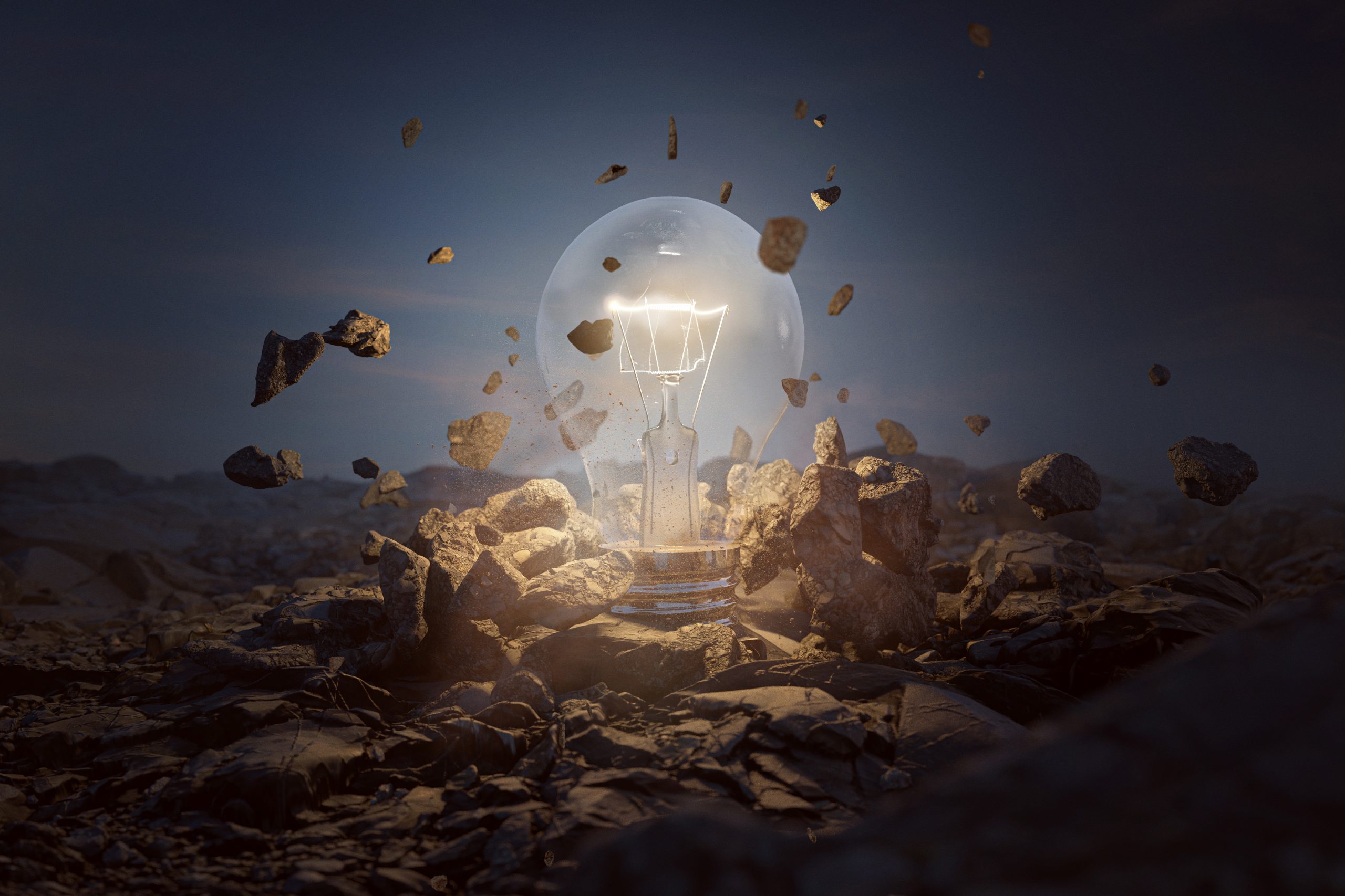 A glowing light bulb surrounded by floating rocks, illuminating a dark, rocky landscape.