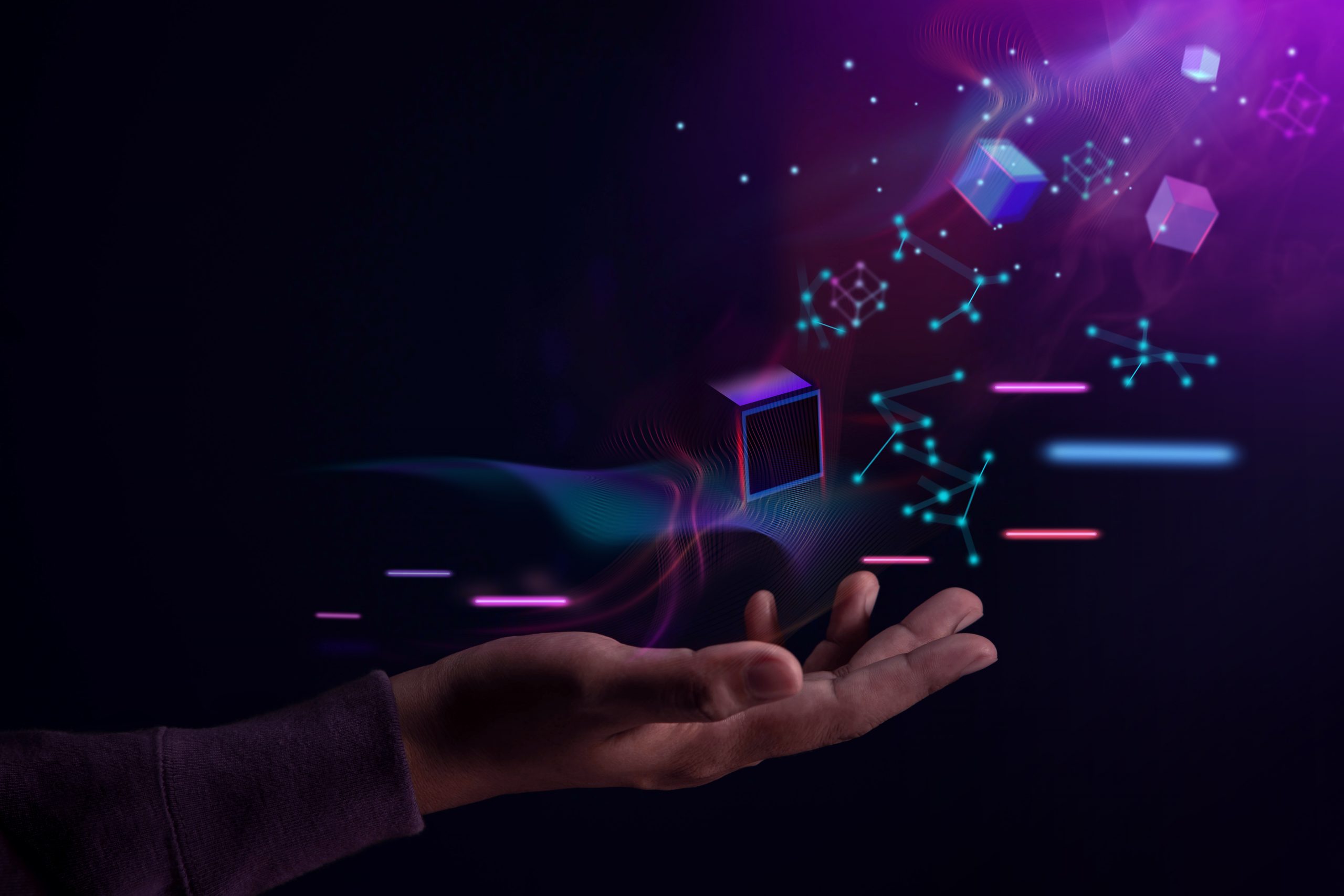 A hand extends toward floating, glowing cubes and abstract shapes against a dark background, suggesting digital innovation.