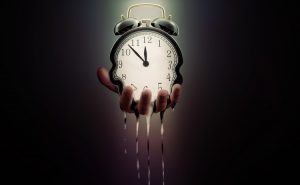A hand holds a melting alarm clock, with time frozen at 12:00, against a dark, gradient background.