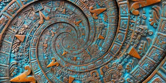 Intricate bronze spiral design featuring Aztec motifs and vibrant turquoise accents, creating a mesmerizing depth effect.