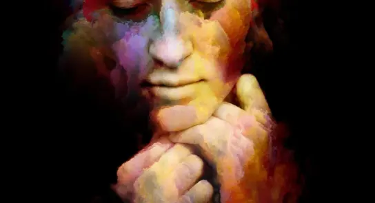 A serene face emerges from vibrant, swirling colors, conveying a sense of introspection and calm.
