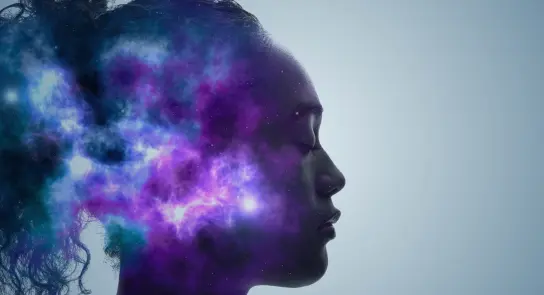 Silhouette of a woman with a cosmic, colorful nebula emerging from her head against a light background.
