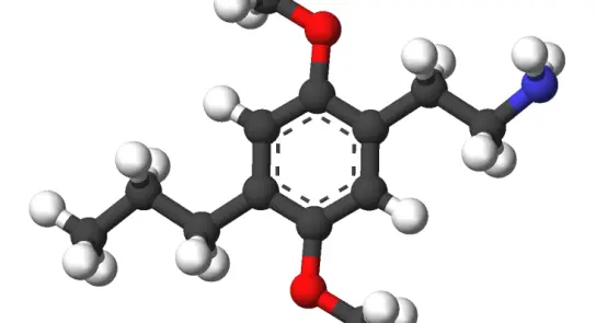 3D molecular structure with black, white, red, and blue spheres representing atoms, connected by gray bonds.