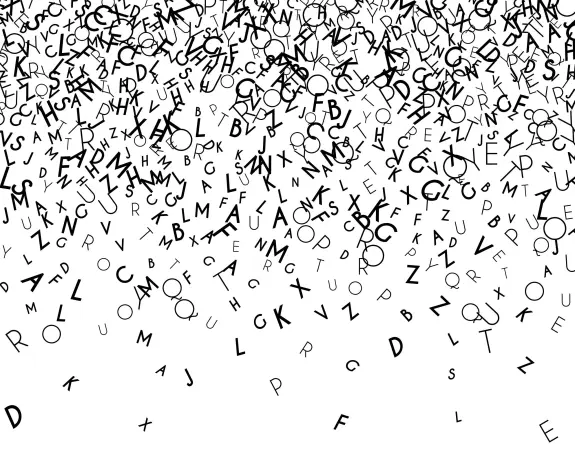 A chaotic arrangement of black letters cascading downward against a white background.