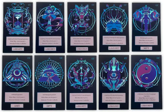 A collection of ten colorful, intricate cards featuring unique symbols and designs, each labeled with a code.