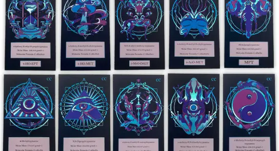 A collection of ten colorful, intricate cards featuring unique symbols and designs, each labeled with a code.