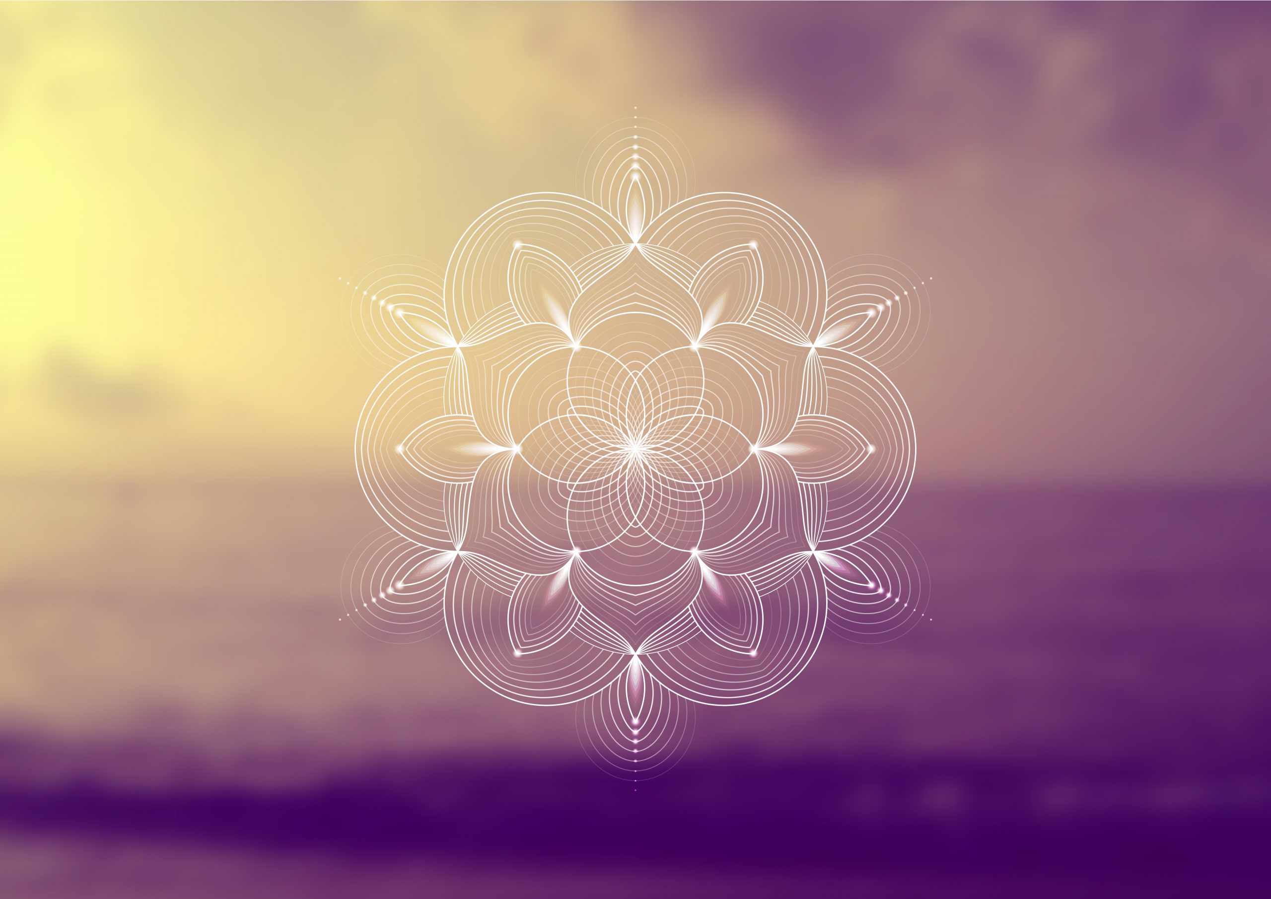 Intricate mandala design in soft pastel hues, set against a blurred ocean background.