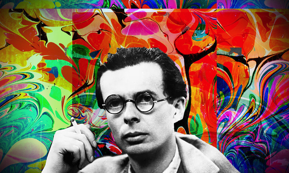 A man with glasses and a cigarette poses against a vibrant, swirling abstract background of colors.