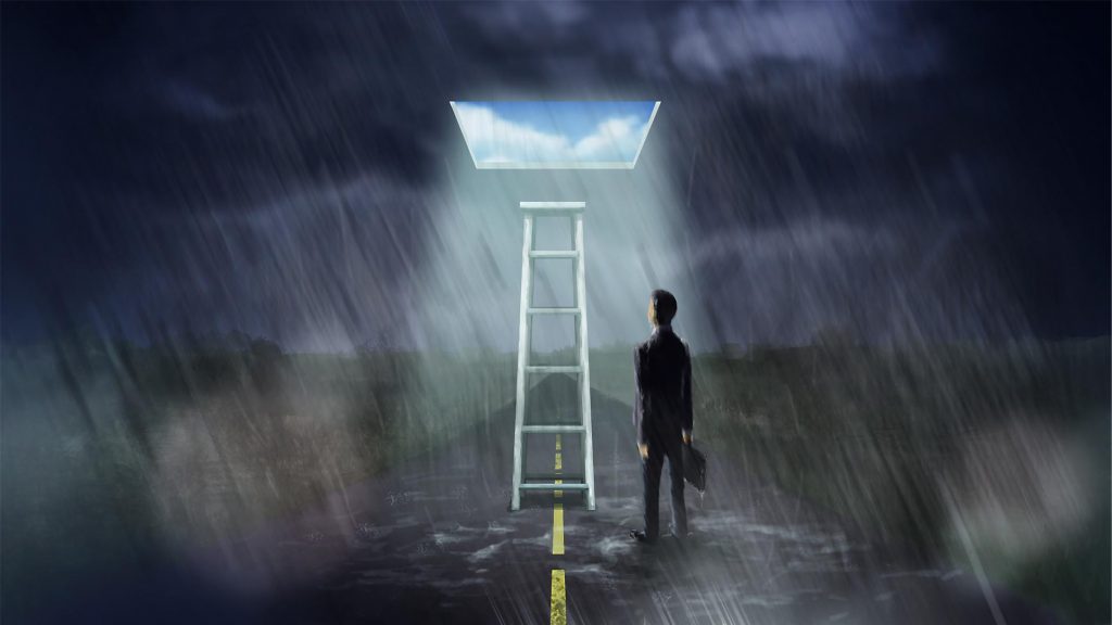 A man in a suit stands on a rain-soaked road, gazing at a glowing ladder leading to a bright sky.