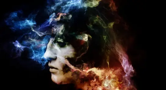 A profile of a face surrounded by vibrant, swirling colors and ethereal smoke against a dark background.