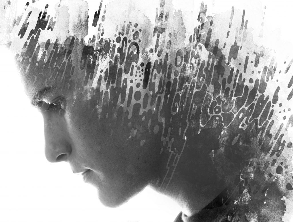 A profile of a young man, overlaid with abstract black and white textures, creating a dramatic artistic effect.