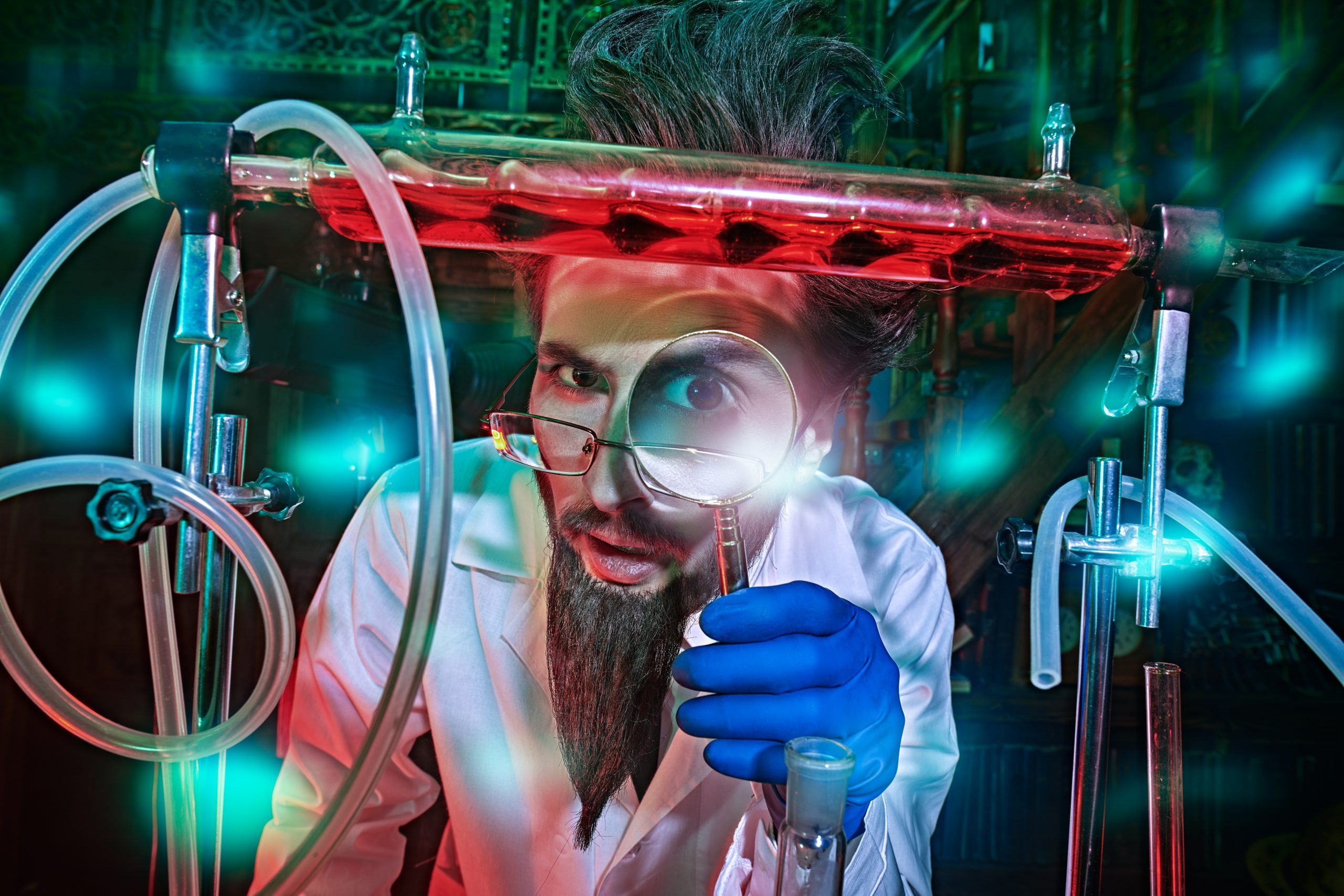 A scientist in a lab coat examines a test tube with a magnifying glass, surrounded by colorful glassware and glowing lights.