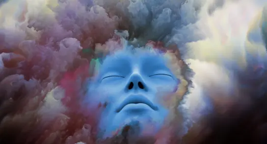 A serene blue face emerges from a swirling, colorful cloud of abstract patterns and textures.