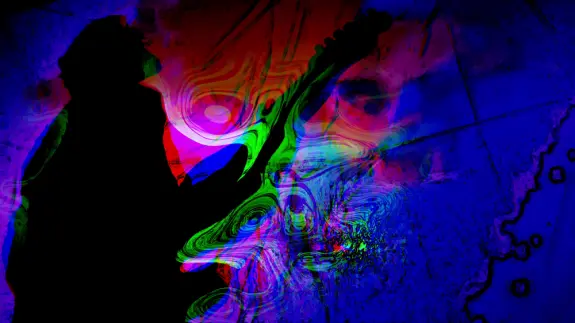 Silhouette of a guitarist against a vibrant, abstract background of swirling colors in red, blue, and green.