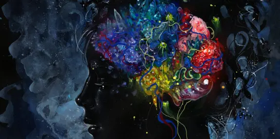 Silhouette of a head filled with vibrant, swirling colors and abstract floral elements against a dark background.