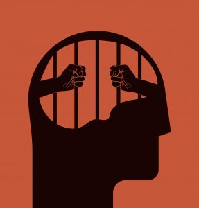 Silhouette of a head with prison bars, hands gripping the bars, symbolizing mental confinement or struggle.