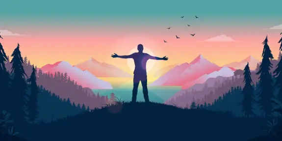 Silhouette of a person with outstretched arms against a colorful sunset over mountains and a lake, surrounded by trees.