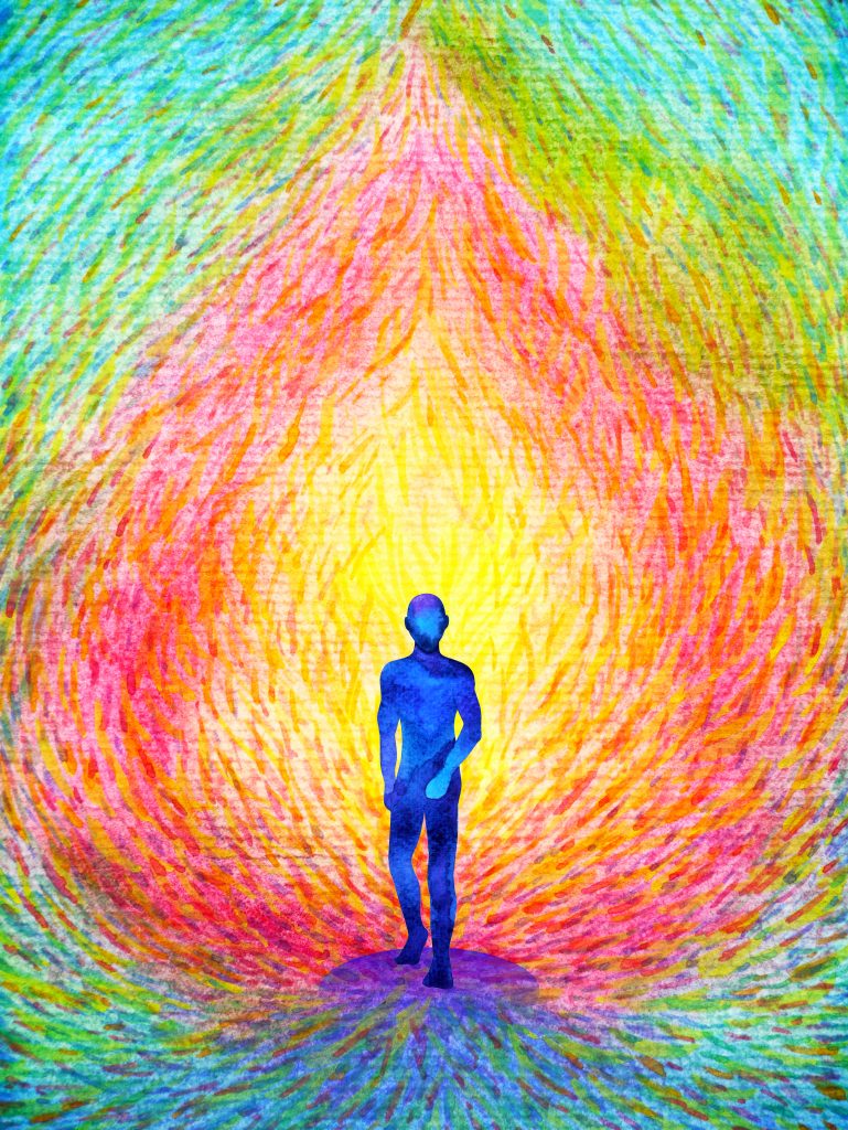 Silhouette of a person walking towards a vibrant, swirling explosion of colors in a radiant background.