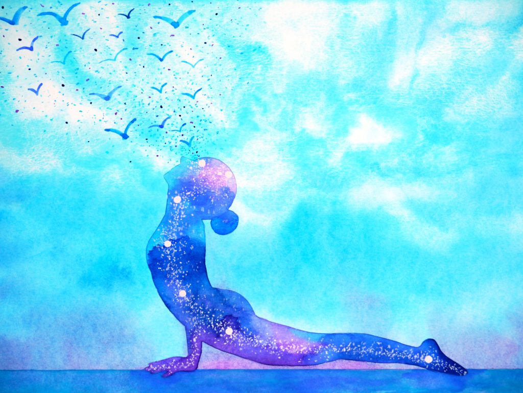 Silhouette of a person in a yoga pose, surrounded by swirling galaxies and birds flying against a blue sky.