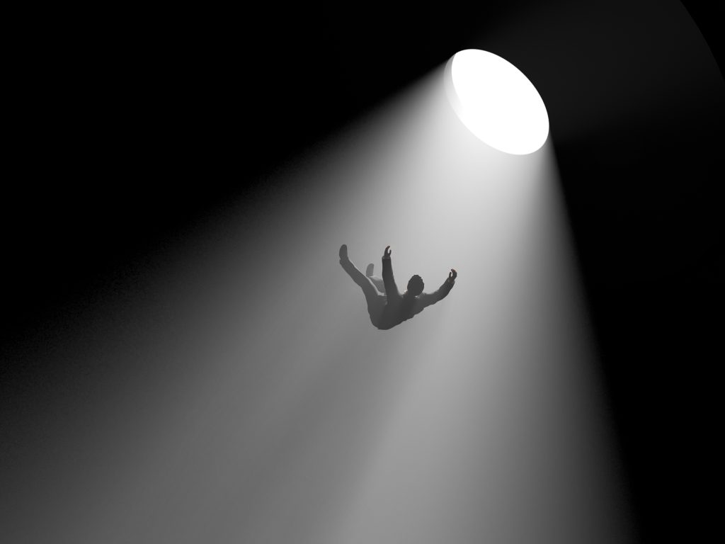 A silhouetted figure falls through a dark space, illuminated by a bright circular light above.