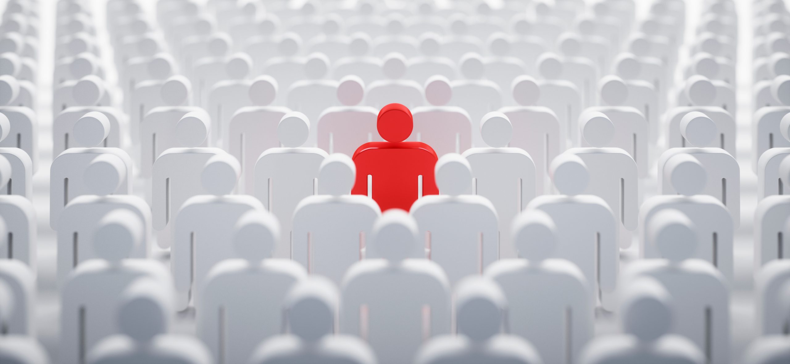 A single red figure stands out among a sea of white figures, symbolizing individuality in a crowd.