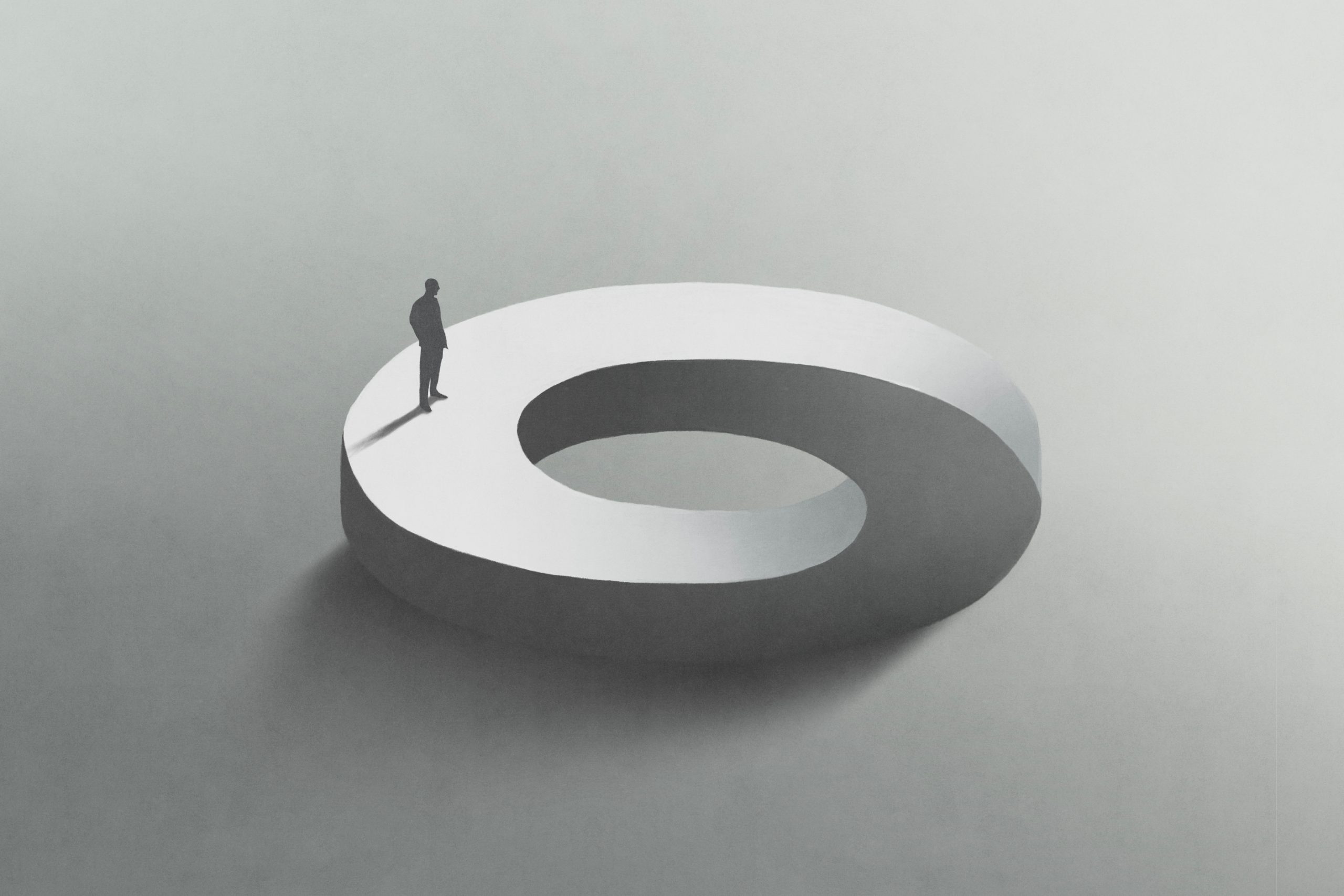 A solitary figure stands on a large, abstract, white infinity symbol against a soft gray background.