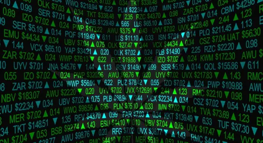 Stock market data displayed on a digital screen with green and black numbers, symbols, and upward trends.