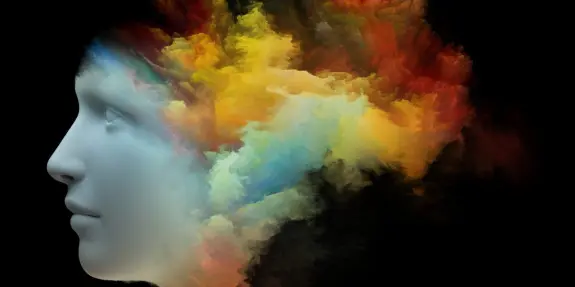 A stylized human profile with vibrant, colorful clouds emanating from the head against a black background.