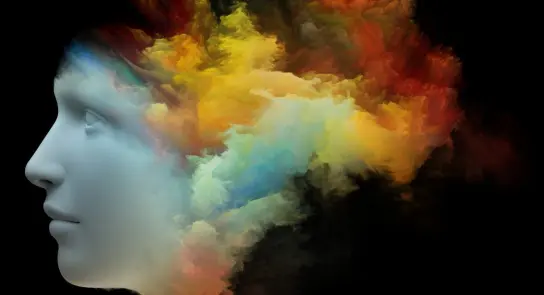 A stylized human profile with vibrant, colorful clouds emanating from the head against a black background.