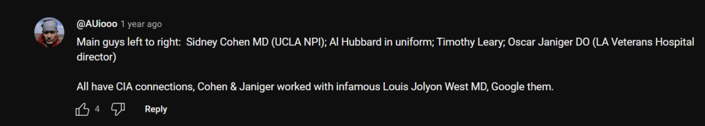 Three men in uniforms, standing together, with a hospital backdrop. They appear engaged in conversation.