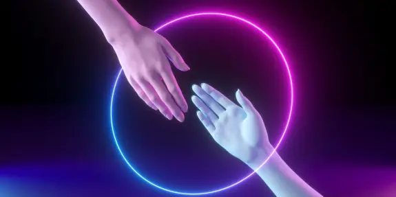 Two stylized hands reaching toward each other, surrounded by glowing pink and blue circular light.