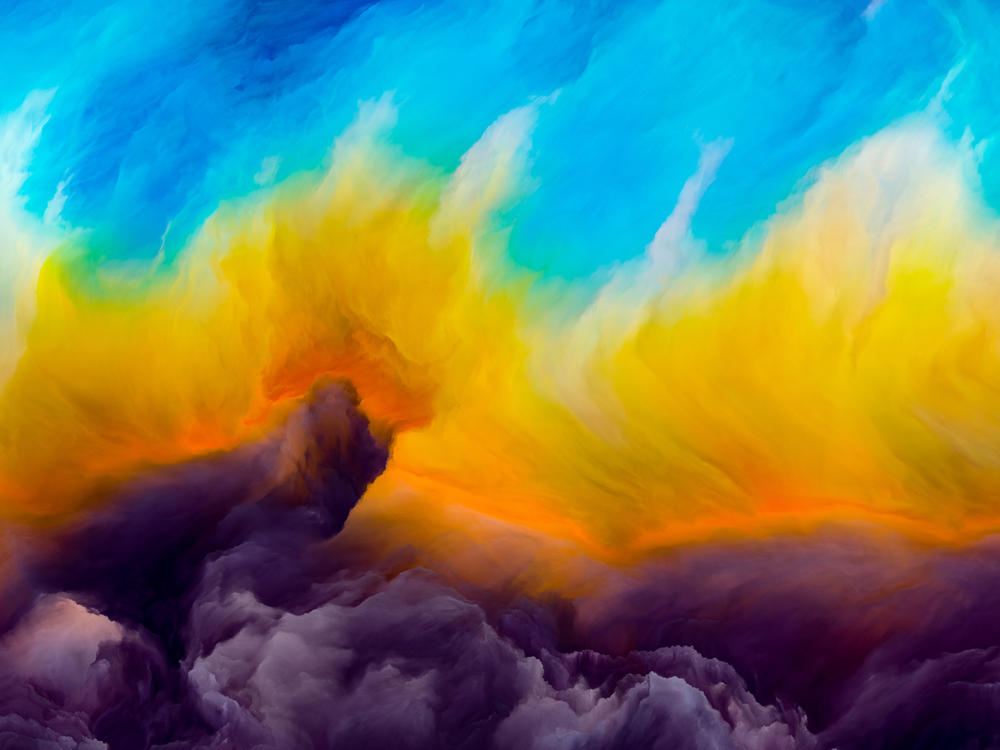 Vibrant abstract clouds blend shades of blue, yellow, orange, and purple, creating a dramatic sky scene.