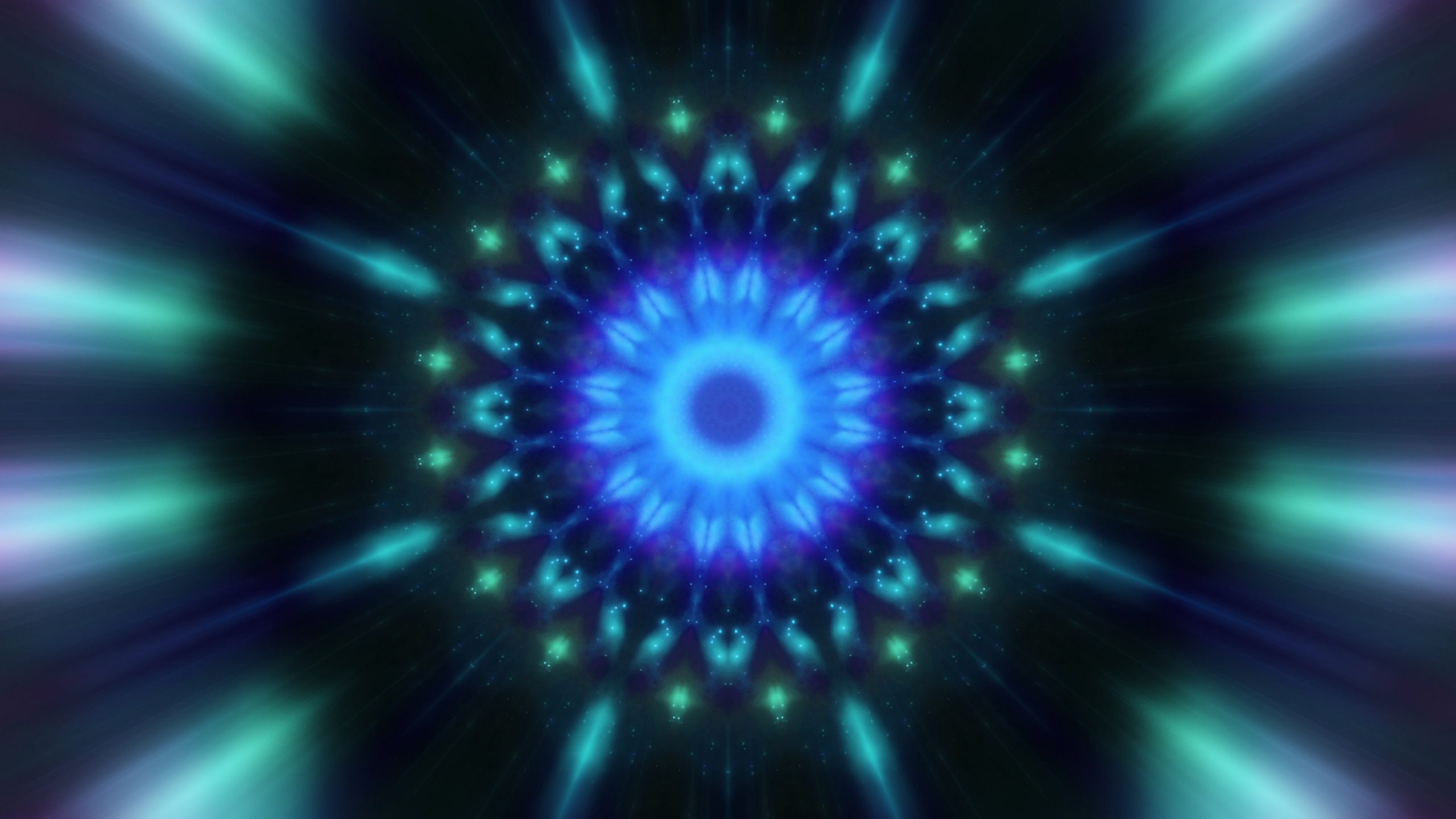 Vibrant blue and green mandala with radiating beams, set against a dark background, creating a mesmerizing visual effect.