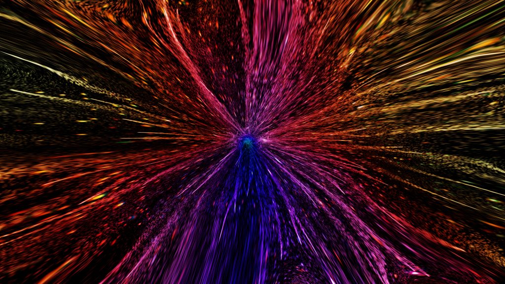 Vibrant explosion of colors radiating outward, creating a dynamic, abstract burst effect against a dark background.