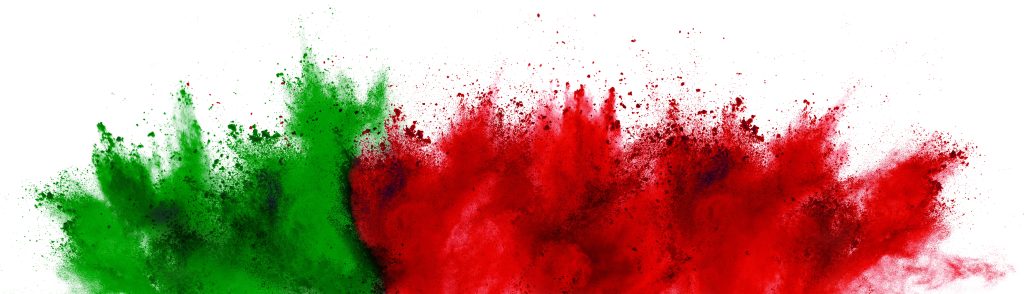 Vibrant red and green powder bursts against a white background, creating a dynamic and colorful explosion.