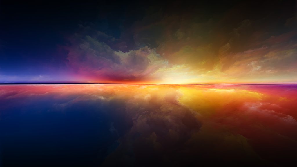 Vibrant sunset reflecting on a calm water surface, with rich hues of orange, purple, and deep blue in the sky.