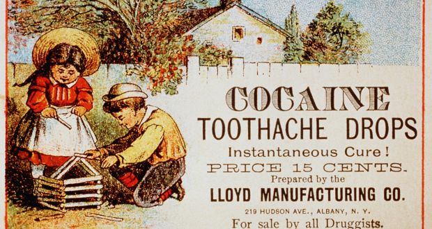 Vintage advertisement for Cocaine Toothache Drops featuring a girl in a straw hat and a boy playing with wooden blocks.
