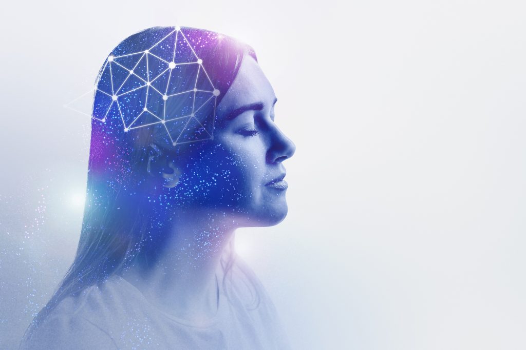 A woman with closed eyes, her profile blended with a cosmic network of stars and geometric shapes.